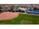 Enjoy a baseball field, clubhouse, and tennis courts in this vibrant residential community at 18119 W Spencer Dr, Surprise, AZ 85374