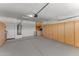 Spacious garage features epoxy floors, storage cabinets, and water heater at 18119 W Spencer Dr, Surprise, AZ 85374