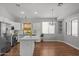 Modern kitchen with white cabinets, stainless appliances, and eat-in nook at 18119 W Spencer Dr, Surprise, AZ 85374
