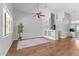 Spacious living room featuring built-in shelving, hardwood floors, and natural light at 18119 W Spencer Dr, Surprise, AZ 85374