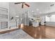 Open-concept living space showcasing hardwood floors, and modern decor at 18119 W Spencer Dr, Surprise, AZ 85374