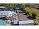 Aerial view of community tennis courts, swimming pool, and buildings at 18119 W Spencer Dr, Surprise, AZ 85374