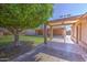 The covered back patio features decorative tile and provides shade from the sun at 1911 N 42Nd Ave, Phoenix, AZ 85009