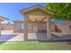 The covered back patio features decorative tile and brick support columns at 1911 N 42Nd Ave, Phoenix, AZ 85009