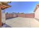 Wide-open concrete backyard surrounded by block wall and privacy fence at 1911 N 42Nd Ave, Phoenix, AZ 85009