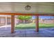 Covered patio and view of backyard with green grass and mature shade tree at 1911 N 42Nd Ave, Phoenix, AZ 85009