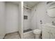 Bathroom with a new shower, stylish vanity, tiled floors, and modern fixtures at 1911 N 42Nd Ave, Phoenix, AZ 85009