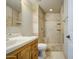 Bathroom showcasing tiled walls and a walk-in shower with built-in shelves at 1911 N 42Nd Ave, Phoenix, AZ 85009
