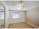 Simple bedroom with wood floors, a ceiling fan, and standard window blinds at 1911 N 42Nd Ave, Phoenix, AZ 85009