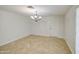 Neutral dining room with chandelier lighting and tile flooring at 1911 N 42Nd Ave, Phoenix, AZ 85009
