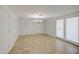 Bright dining room offers a chandelier and a sliding glass door for natural lighting at 1911 N 42Nd Ave, Phoenix, AZ 85009
