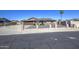 Charming single-story home with a brown tile roof, desert landscaping, and a secure front fence at 1911 N 42Nd Ave, Phoenix, AZ 85009