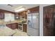 Spacious kitchen featuring granite countertops, stainless steel appliances, and ample cabinet space at 1911 N 42Nd Ave, Phoenix, AZ 85009