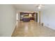 Bright and spacious living room with tile floors that flows into a gourmet kitchen with island at 1911 N 42Nd Ave, Phoenix, AZ 85009