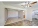 Open-concept living area featuring tile and wood flooring, a ceiling fan, and recessed lighting at 1911 N 42Nd Ave, Phoenix, AZ 85009