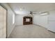 Open living space with neutral tile floors and a ceiling fan for comfort at 1911 N 42Nd Ave, Phoenix, AZ 85009
