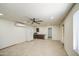 The spacious living area is equipped with tile floors, ceiling fan, and a kitchenette at 1911 N 42Nd Ave, Phoenix, AZ 85009