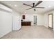 The room boasts tile flooring, a ceiling fan, a kitchenette, and access to a bathroom at 1911 N 42Nd Ave, Phoenix, AZ 85009