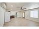 Living space with tile flooring, kitchenette, ceiling fan, and a bathroom nearby at 1911 N 42Nd Ave, Phoenix, AZ 85009