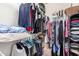 Organized walk-in closet with clothing racks, shelves, and floor storage at 1941 S Pierpont Dr # 1037, Mesa, AZ 85206