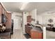 Well-lit kitchen features updated appliances and bar seating with living room view at 1941 S Pierpont Dr # 1037, Mesa, AZ 85206