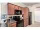 Bright kitchen featuring modern appliances, including black refrigerator and microwave at 1941 S Pierpont Dr # 1037, Mesa, AZ 85206
