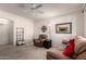 The spacious living room features neutral carpet with front door and hall access at 1941 S Pierpont Dr # 1037, Mesa, AZ 85206