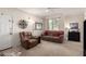 Inviting living room boasts neutral carpet, accent wall decor, and comfortable furnishings at 1941 S Pierpont Dr # 1037, Mesa, AZ 85206