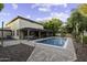 This home features a swimming pool, covered patio, and desert landscaping at 1953 E Lafayette Ave, Gilbert, AZ 85298