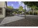 Relaxing backyard with pergola-covered patio, swing, and a refreshing pool, perfect for outdoor enjoyment at 1953 E Lafayette Ave, Gilbert, AZ 85298