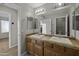 Bathroom boasts double sinks, tile countertop, and stylish vanity lighting at 1953 E Lafayette Ave, Gilbert, AZ 85298