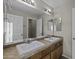 Bathroom featuring double sinks, spacious mirror, and tile countertop at 1953 E Lafayette Ave, Gilbert, AZ 85298