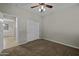 Cozy bedroom with neutral walls, carpet flooring, and a sliding door closet providing a comfortable and organized space at 1953 E Lafayette Ave, Gilbert, AZ 85298