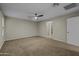 Spacious bedroom with ceiling fan and neutral carpet, ready for personalization at 1953 E Lafayette Ave, Gilbert, AZ 85298