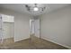 This bedroom features carpet flooring, neutral walls, and a ceiling fan at 1953 E Lafayette Ave, Gilbert, AZ 85298