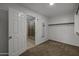 Carpeted bedroom with an open en-suite bathroom and walk-in closet at 1953 E Lafayette Ave, Gilbert, AZ 85298