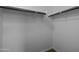 This walk-in closet provides ample storage with clothing rods and shelving at 1953 E Lafayette Ave, Gilbert, AZ 85298