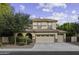 Inviting two-story home featuring a tile roof, multiple car garage, and well-maintained landscaping at 1953 E Lafayette Ave, Gilbert, AZ 85298