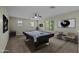 Spacious game room with a pool table, neutral walls, and ample natural light for entertainment at 1953 E Lafayette Ave, Gilbert, AZ 85298