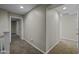 Well-lit upstairs hallway with carpeted floors, connecting various rooms at 1953 E Lafayette Ave, Gilbert, AZ 85298