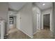 Bright hallway with tile flooring, neutral paint, and modern lighting offers a clean and stylish transition space at 1953 E Lafayette Ave, Gilbert, AZ 85298