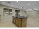 A kitchen island with stainless steel appliances and tile floors at 1953 E Lafayette Ave, Gilbert, AZ 85298