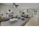 Bright living room with tile flooring, a ceiling fan and dining area that is great for gatherings at 1953 E Lafayette Ave, Gilbert, AZ 85298