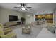 Spacious living room features modern decor, neutral tones, and seamless flow into the kitchen and dining area at 1953 E Lafayette Ave, Gilbert, AZ 85298