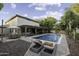 Backyard with a refreshing pool, lounge chairs, a dining table and a covered patio at 1953 E Lafayette Ave, Gilbert, AZ 85298