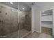 Tiled walk-in shower with a glass door and convenient bench seating at 1953 E Lafayette Ave, Gilbert, AZ 85298