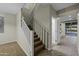 Bright staircase with neutral walls and carpeted steps leading to the upper level of the home at 1953 E Lafayette Ave, Gilbert, AZ 85298