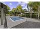 The backyard features a swimming pool, desert landscaping, and string lights at 1953 E Lafayette Ave, Gilbert, AZ 85298
