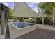 The backyard features a swimming pool, desert landscaping, and a covered patio at 1953 E Lafayette Ave, Gilbert, AZ 85298