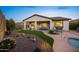 Backyard featuring a pool, covered patio, and desert landscaping creating a relaxing outdoor space at 20438 W Calle Encorvada --, Buckeye, AZ 85396